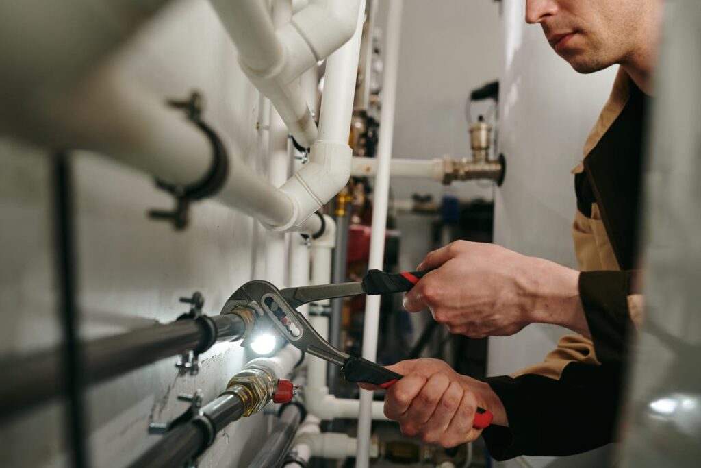 Plumbers maintaining commercial plumbing pipes in Palm Springs